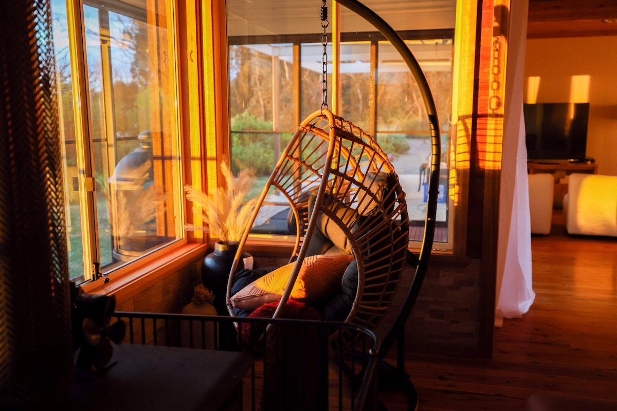 Outdoor sauna and hot tub with mountain views